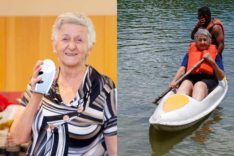 Lidia é uma mulher idosa com cabelos brancos e usa uma blusa com listas circulares preta amarela e branca